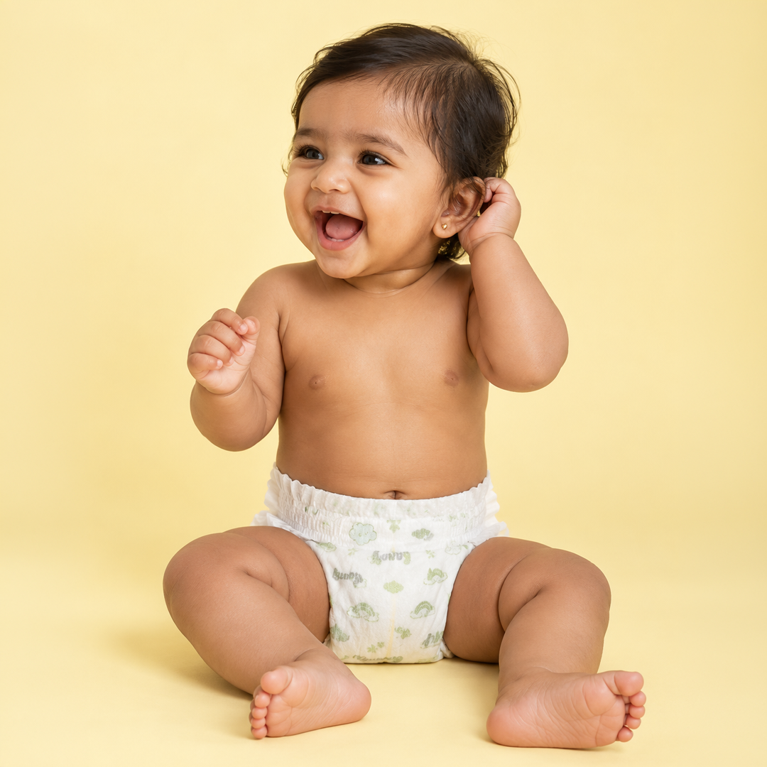 Baby laughing while sitting in a Lumi9 diaper